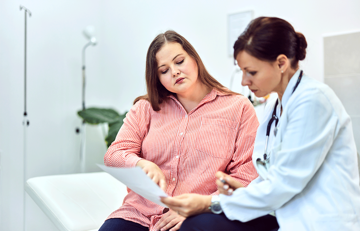 Overweight woman talking to doctor about lab results