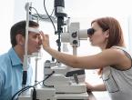 doctor performing eye exam on patient