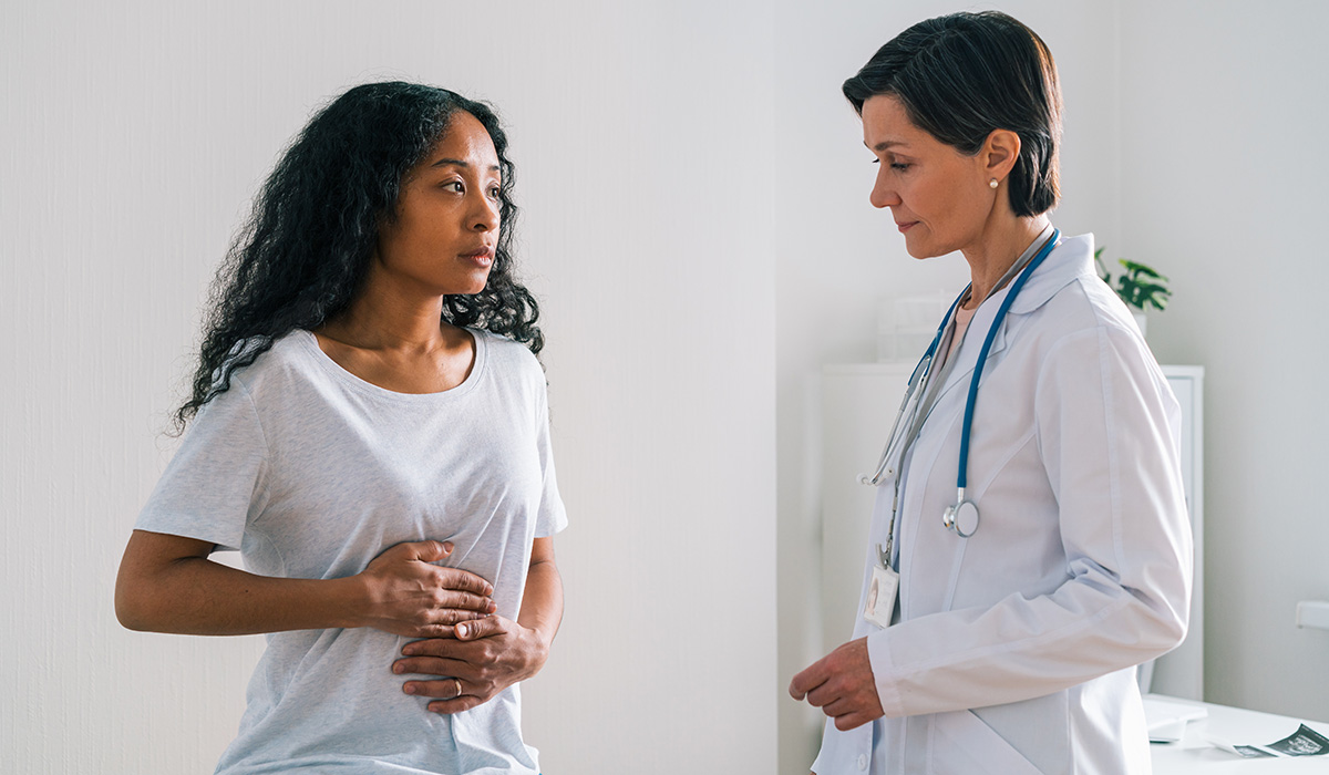 A patient talks to her doctor about gut health. Your primary care doctor can provide guidance on issues that affect your digestion.