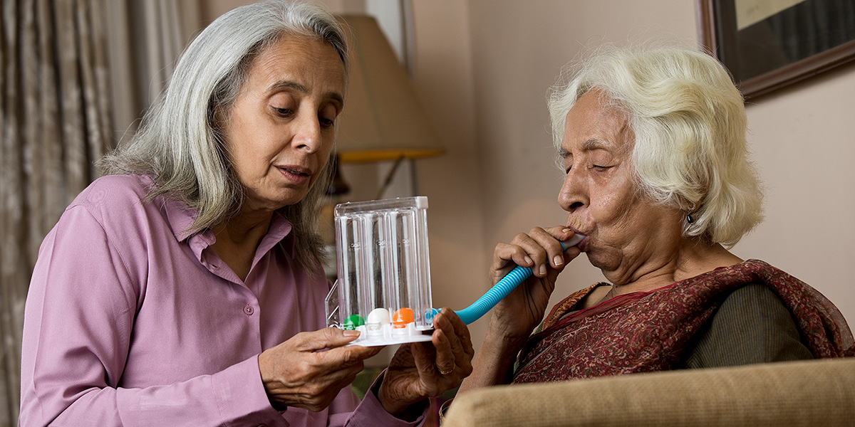A woman tests her lung function. COPD is largely preventable disease, but costly if you develop it.