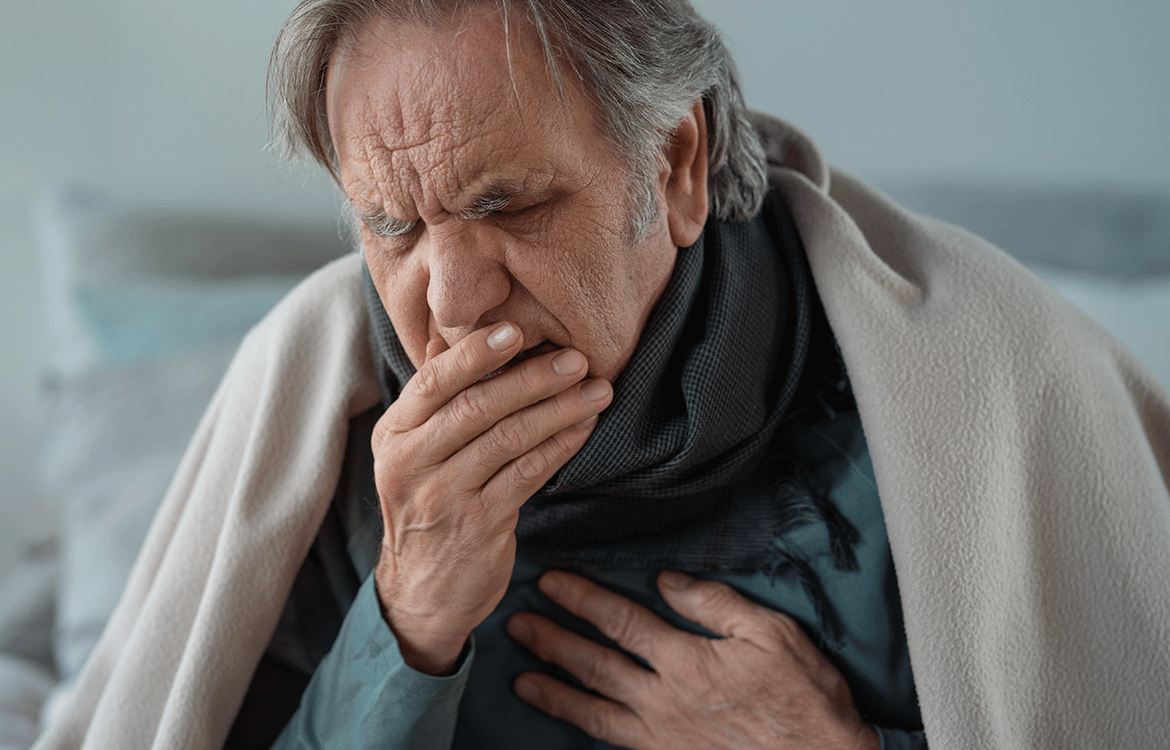 elderly person coughing into hand