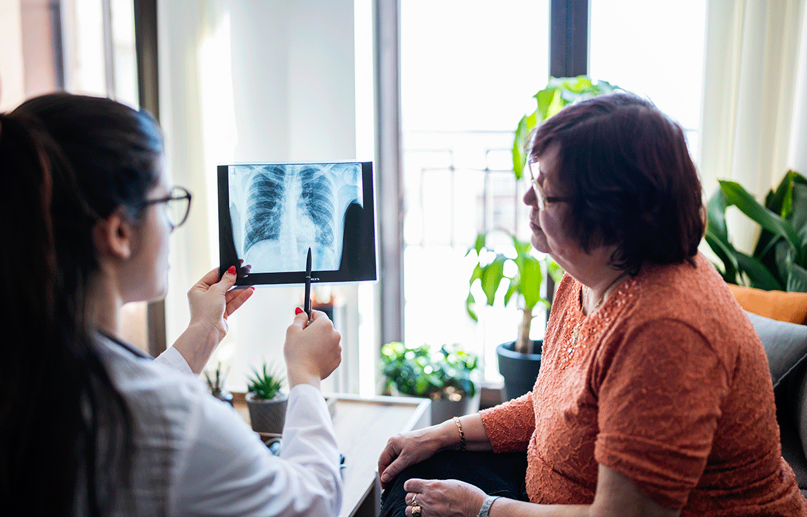 Woman talking to doctor about chest Xray