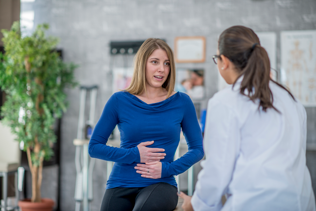 woman speaking with doctor about gut health
