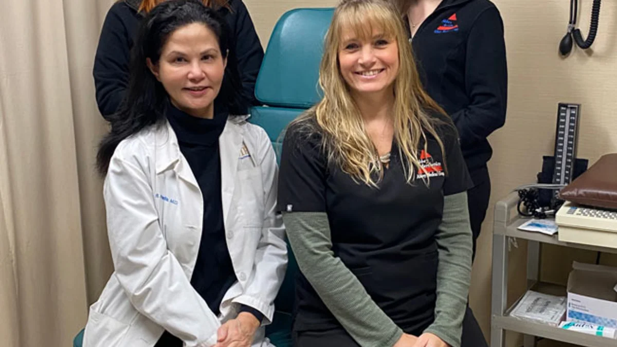 Dr. Padilla and her staff in an exam room