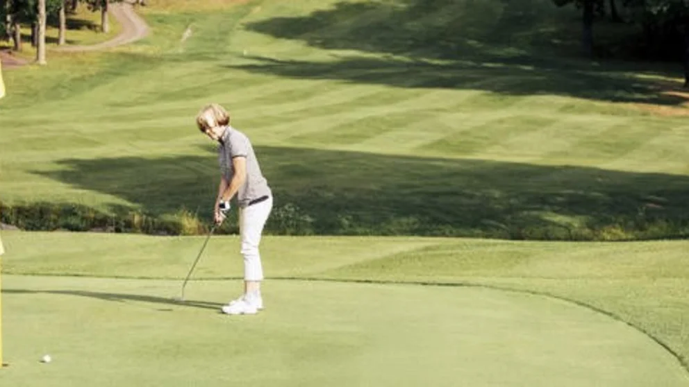 Female golfer on course