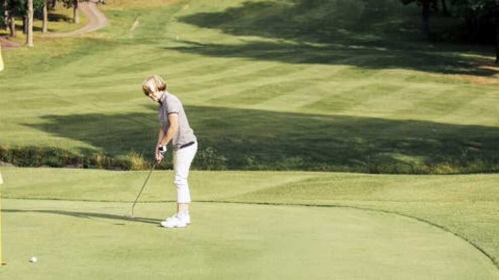 Female golfer on course