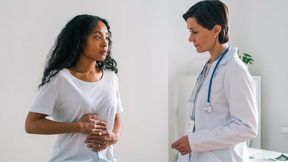 A patient talks to her doctor about gut health. Your primary care doctor can provide guidance on issues that affect your digestion.