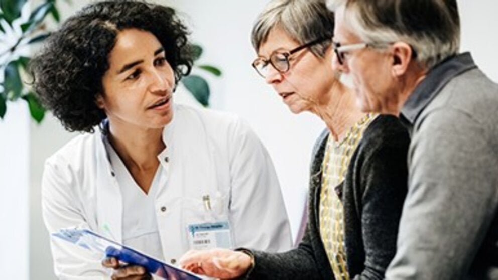 Older couple consulting with physician