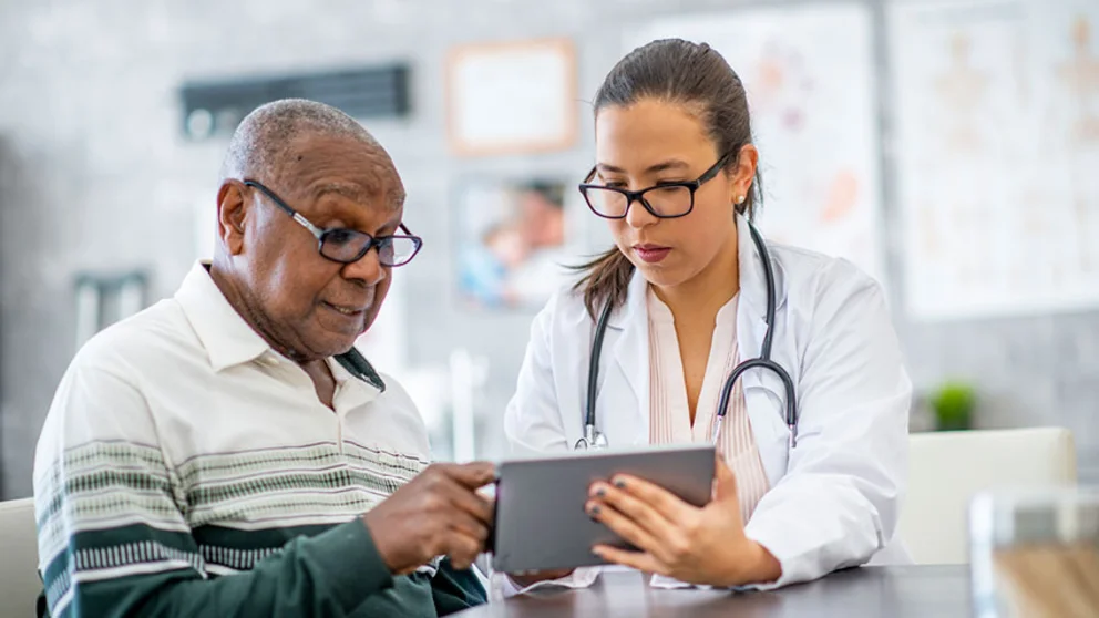 Older gentleman talking to physician