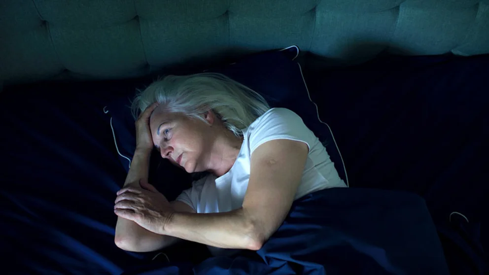 Woman trying to fall asleep