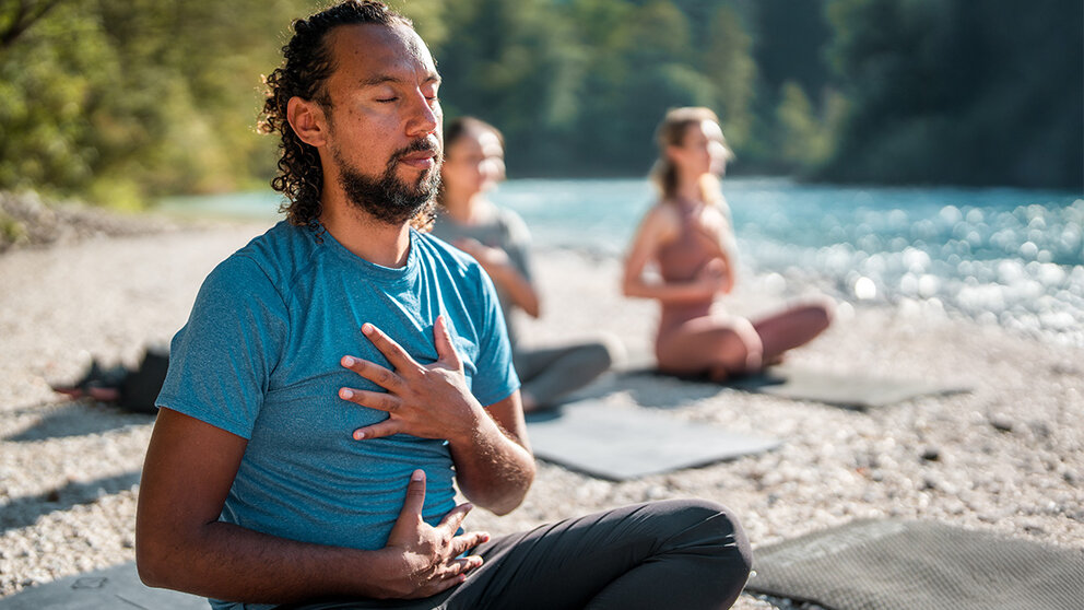 Three people practicing Awareness of Breath Meditation