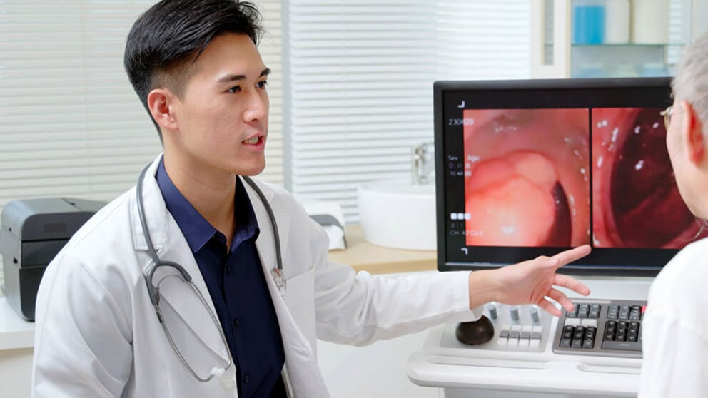 Doctor explaining colon screening to patient