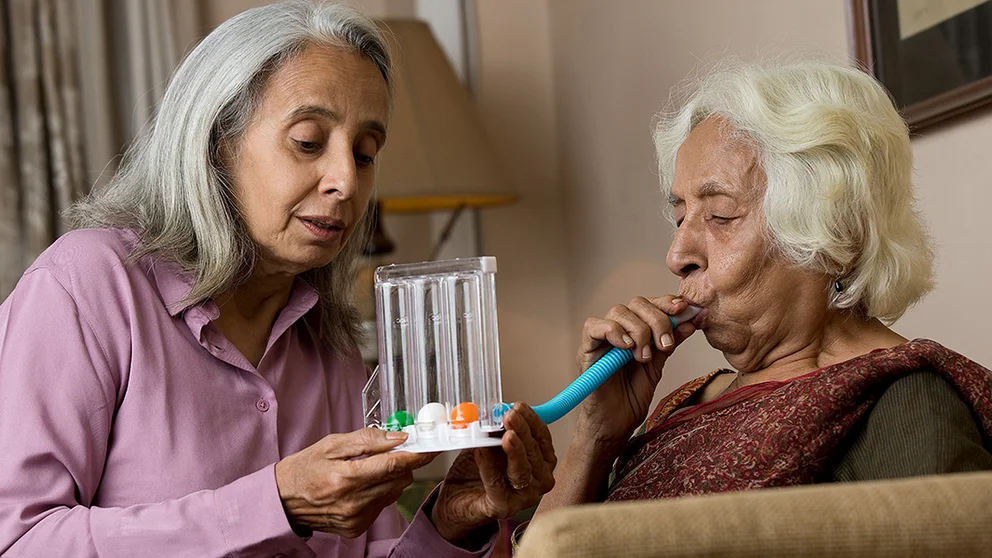 A woman tests her lung function. COPD is largely preventable disease, but costly if you develop it.