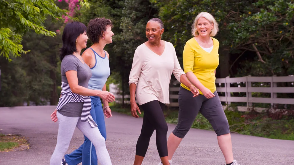 a group of women walking outside