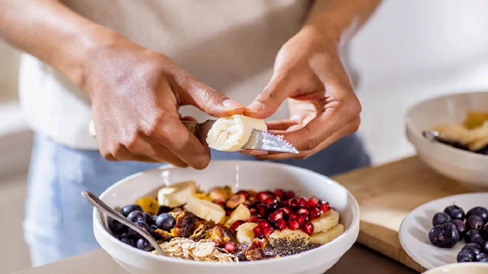 Man preparing healthy snack bowl