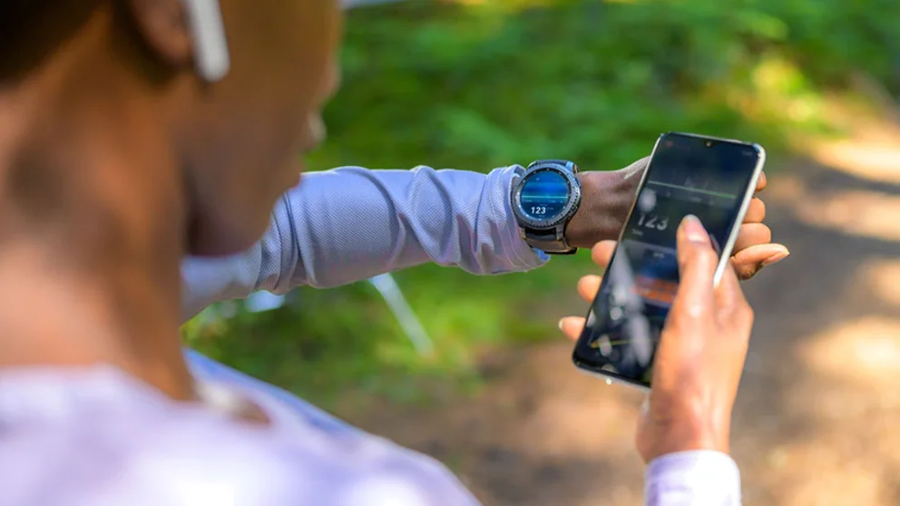 A man looking at health data recorded on his phone