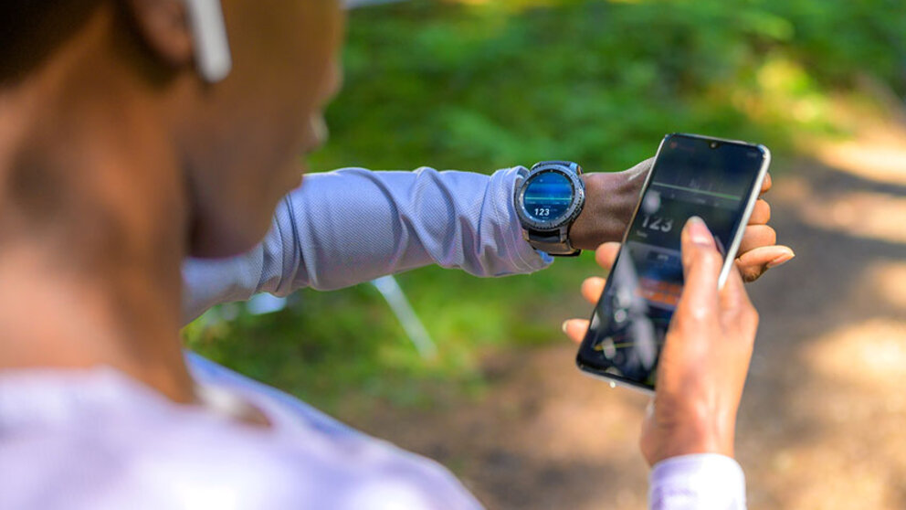 A man looking at health data recorded on his phone