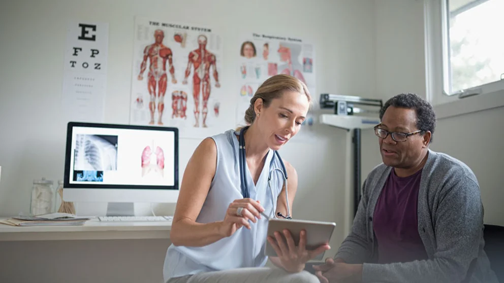 male patient speaking with female physician