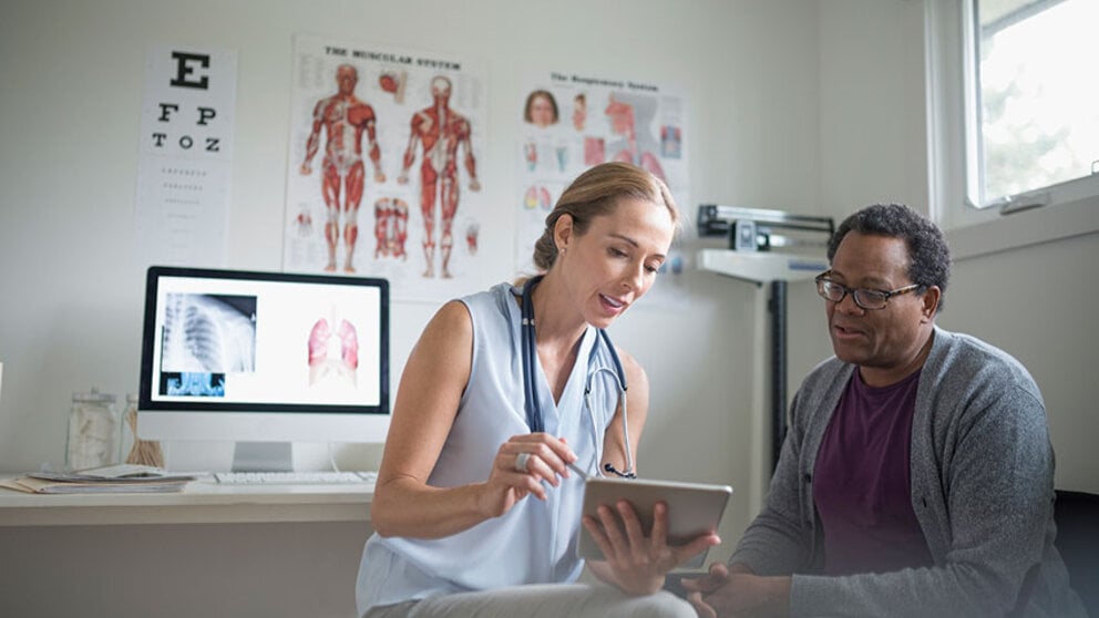 male patient speaking with female physician