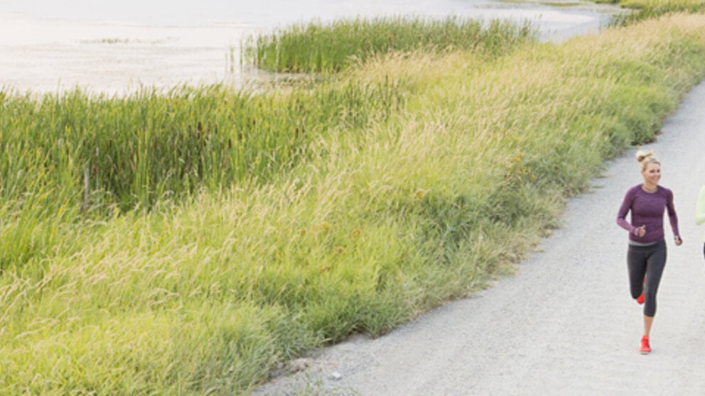 Women jogging on rural road