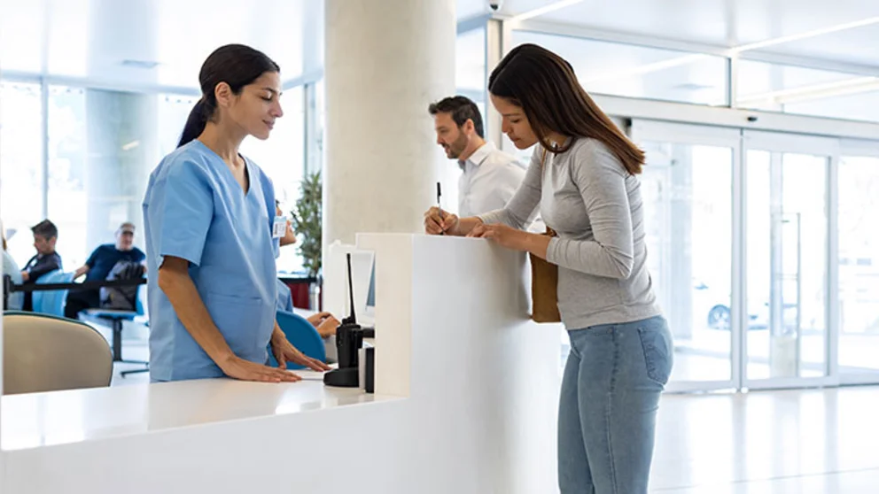 patient and receptionist