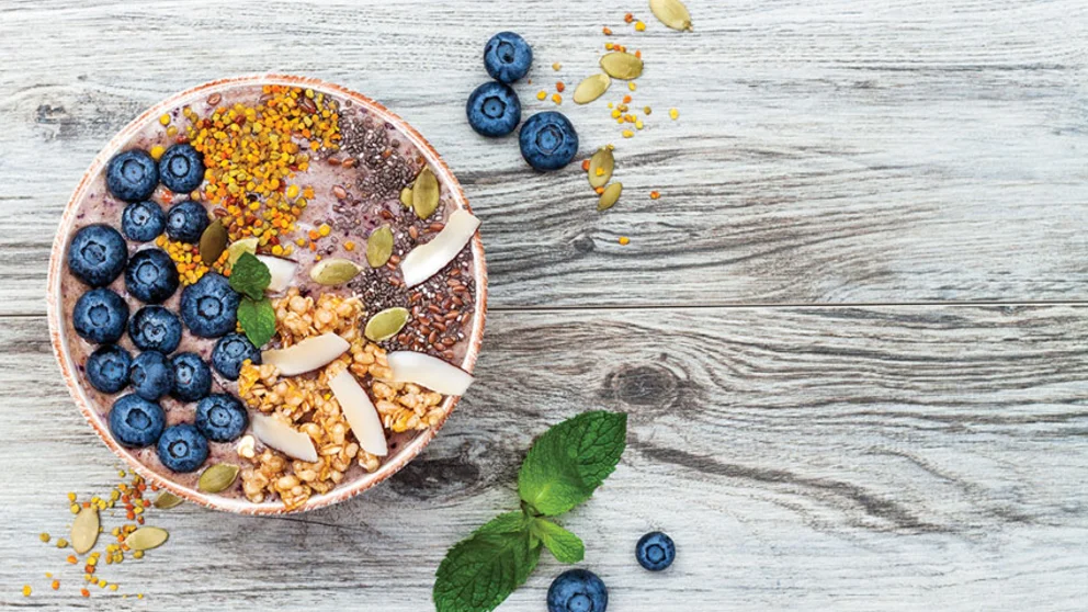 Blueberries with grains in bowl