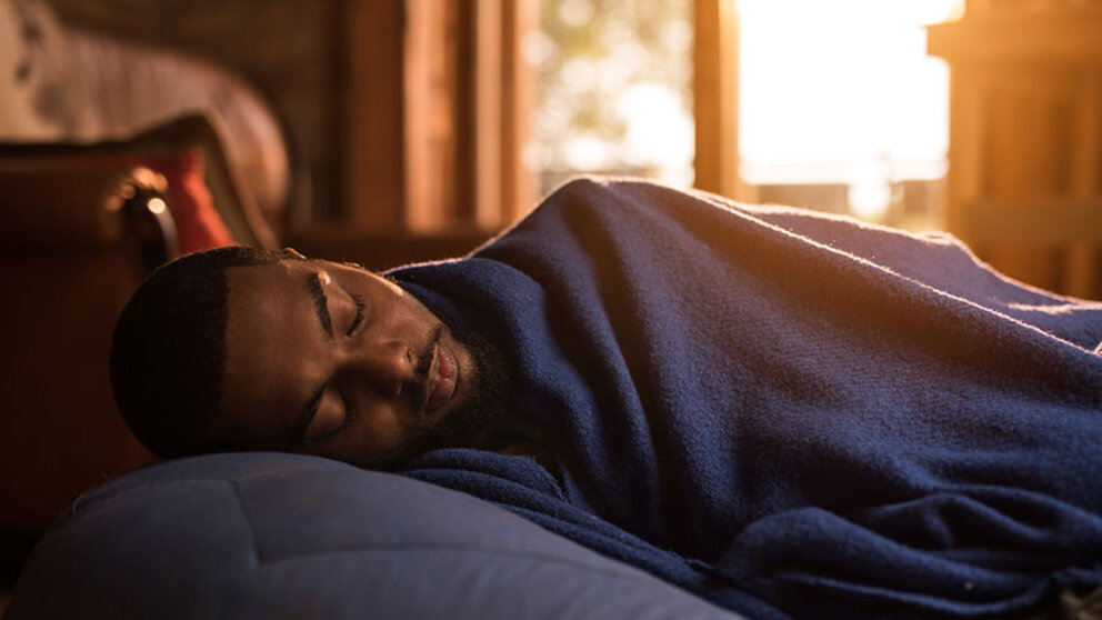 Man sleep under blankets