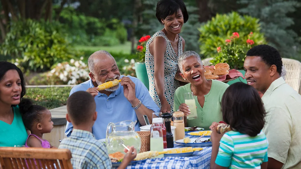 family enjoying meal at a table
