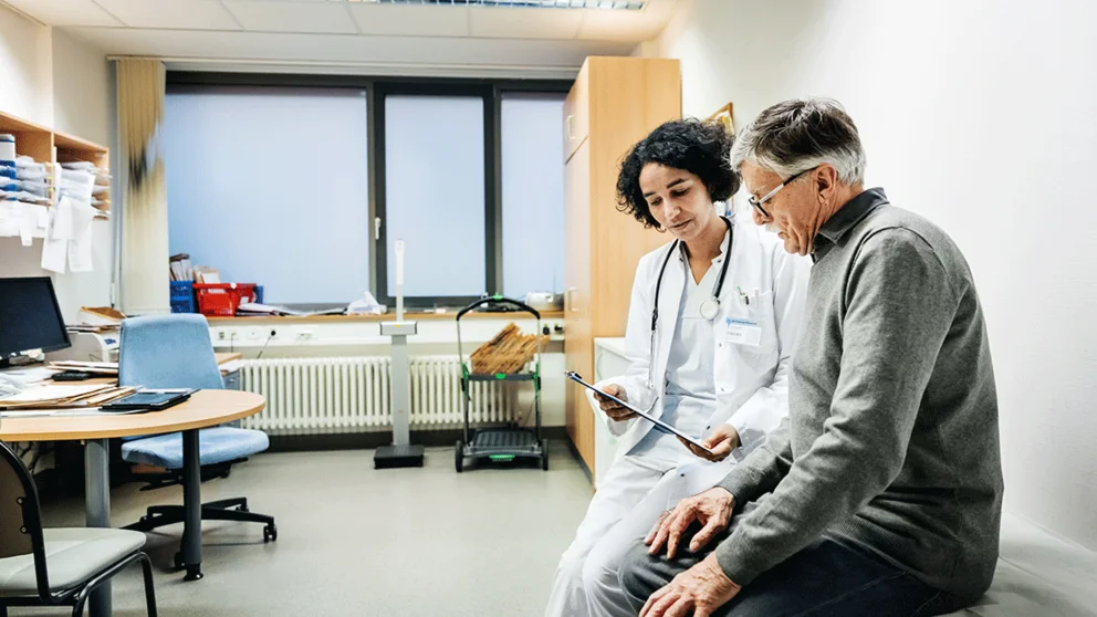 man working with female physician