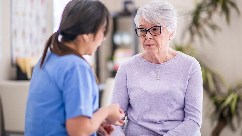 primary care doctor talking to mental health patient