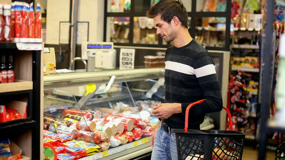 Shopping for processed meat in supermarket