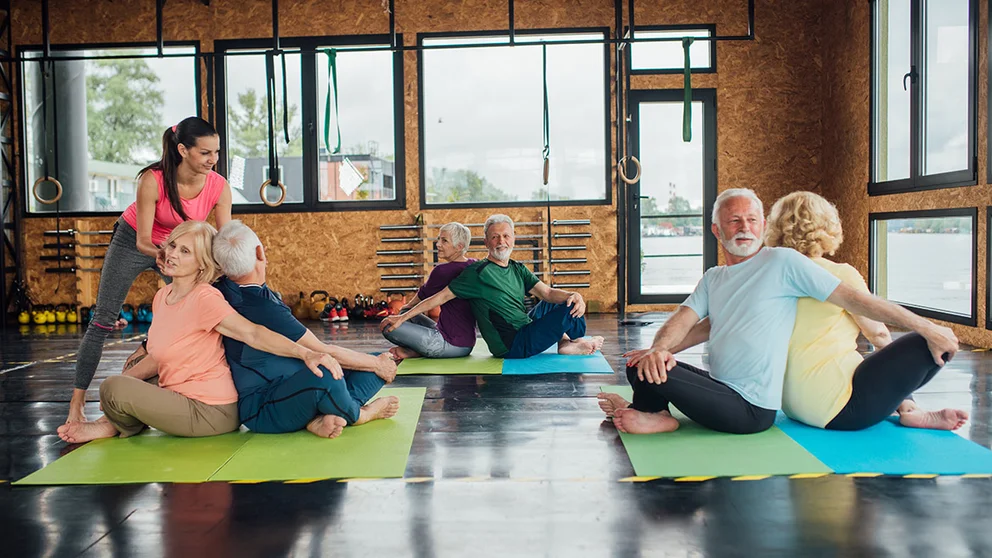 3 couples participating in seating tai chi