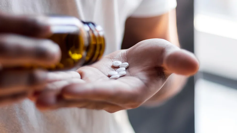 A woman taking supplements