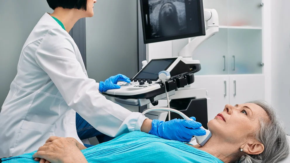 doctor performing medical exam on patient