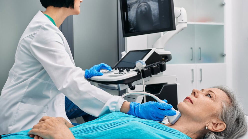 doctor performing medical exam on patient