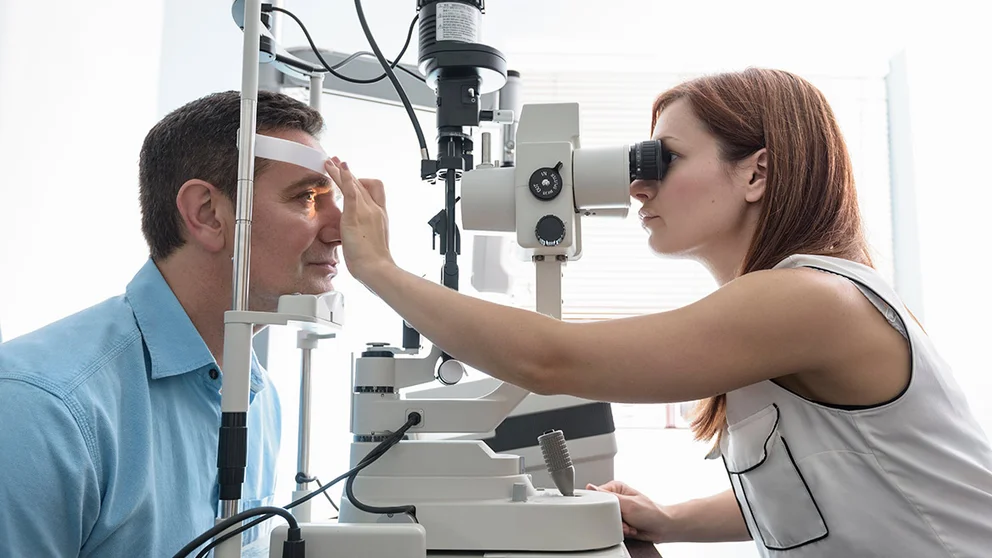 doctor performing eye exam on patient