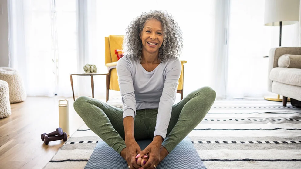 woman practicing yoga at home