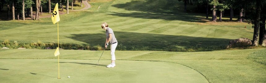 Female golfer on course