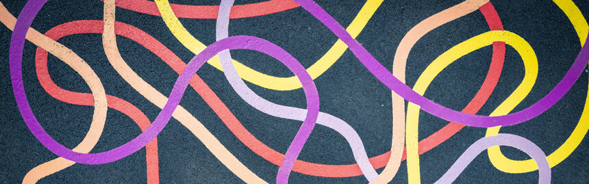 Abstract network of colorful flowing lines on a dark background, symbolizing movement, coordination, and overall wellness.