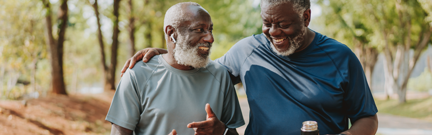 Two older adults enjoying an outdoor walk together, highlighting exercise, social connection, and healthy lifestyle habits that support metabolic health.
