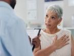 Female patient talking to doctor about heart