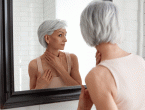 A women looking at herself in the mirror
