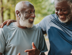 Two older adults enjoying an outdoor walk together, highlighting exercise, social connection, and healthy lifestyle habits that support metabolic health.