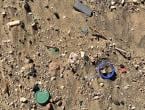 Beach sand with visible plastic debris