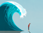Chronic stress can age us faster. A man stands underneath a cresting wave.