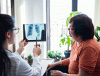 Woman talking to doctor about chest Xray