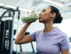 Woman drinking protein shake after workout.