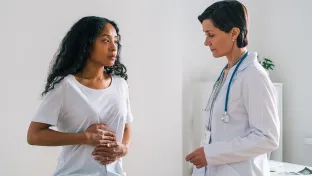 A patient talks to her doctor about gut health. Your primary care doctor can provide guidance on issues that affect your digestion.