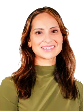 Professional headshot of Dr. Monica Grover, with a friendly smile and a neutral background.