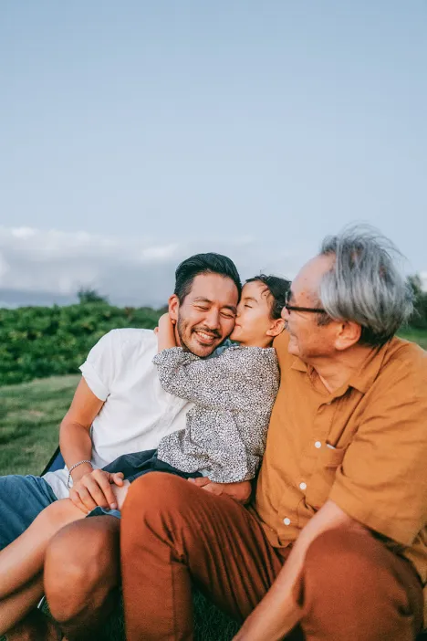 three-generation-family-having-a-good-time-at-dusk